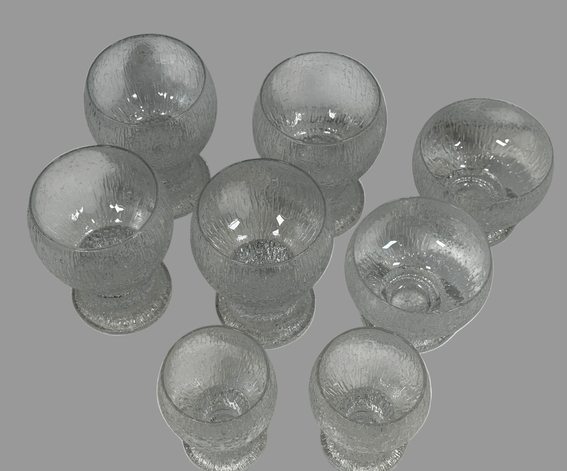 Vintage Iittala Ultima Thule footed glasses set of 8. Finnish design by Tapio Wirkkala. Iconic ice-melt texture. Excellent condition. Fast shipping from Canada.