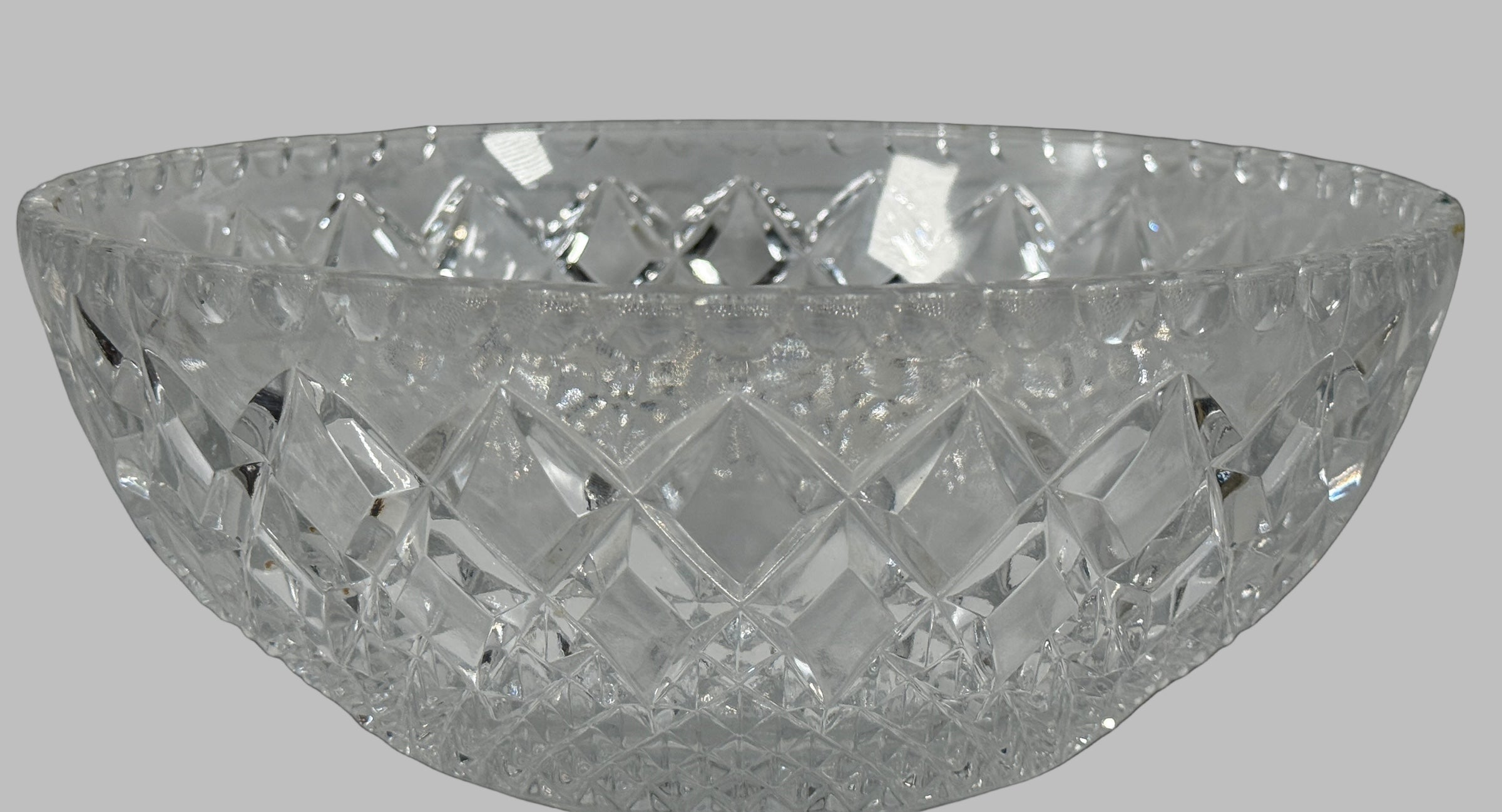 Crystal bowl with cut glass design on a black background