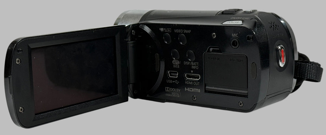 Black video camera with open screen on a white background