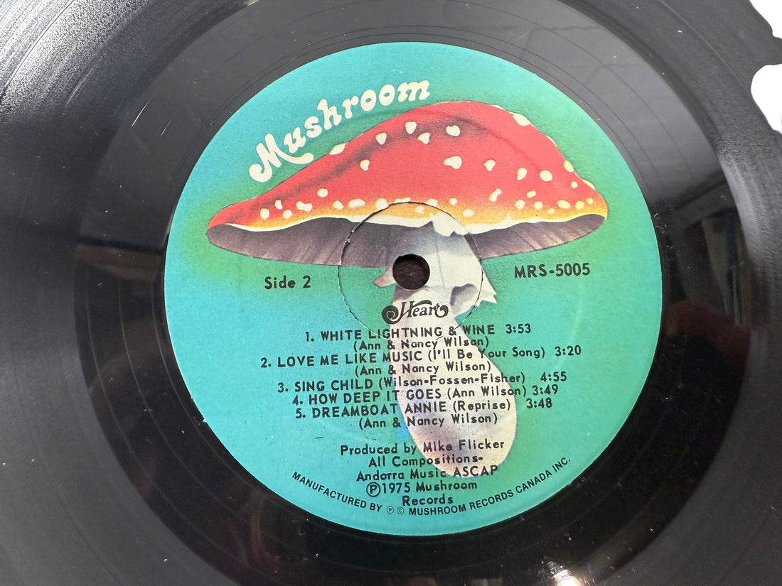 Vintage 1975 Heart Dreamboat Annie Canadian LP on Mushroom Records. Gatefold pressing with classic tracks. Clean collectible copy for rock vinyl fans.