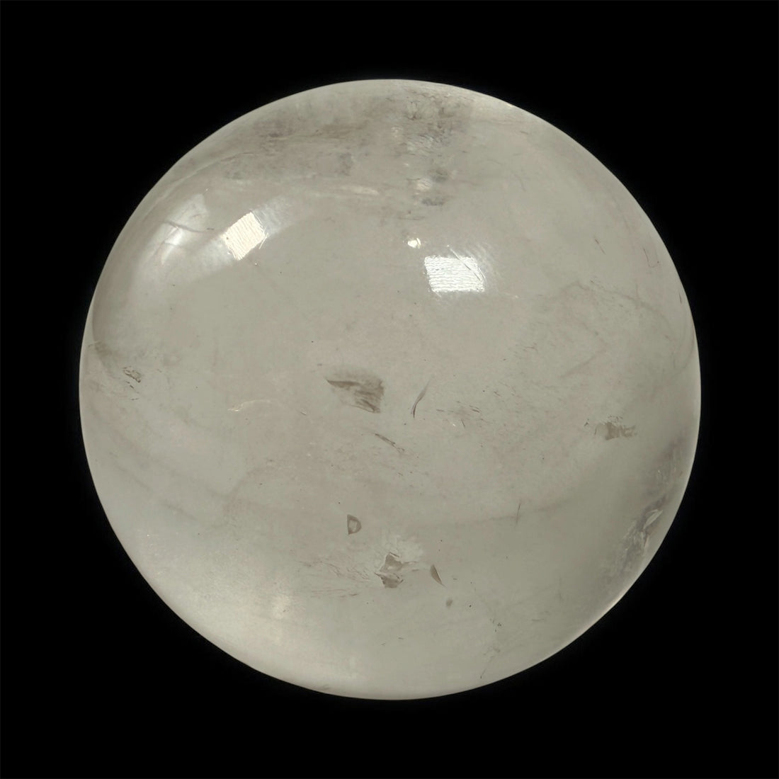 Natural clear quartz crystal sphere 70mm polished orb with beautiful internal veils and inclusions. Decorative display piece for collectors or décor.