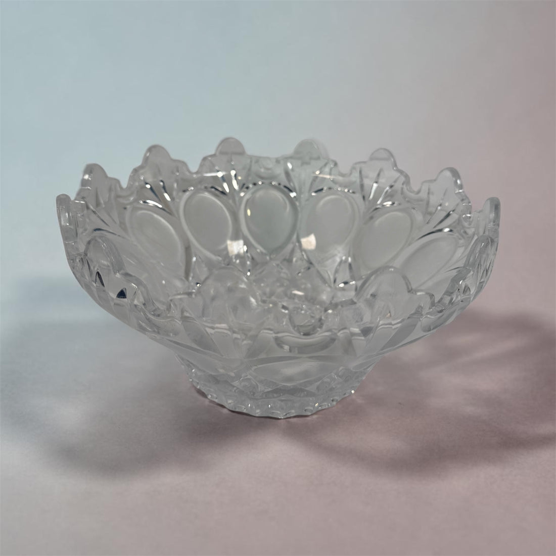 Mid-century pressed glass bowl with frosted thumbprint pattern and scalloped rim. Heavy decorative centerpiece perfect for vintage or retro home decor.