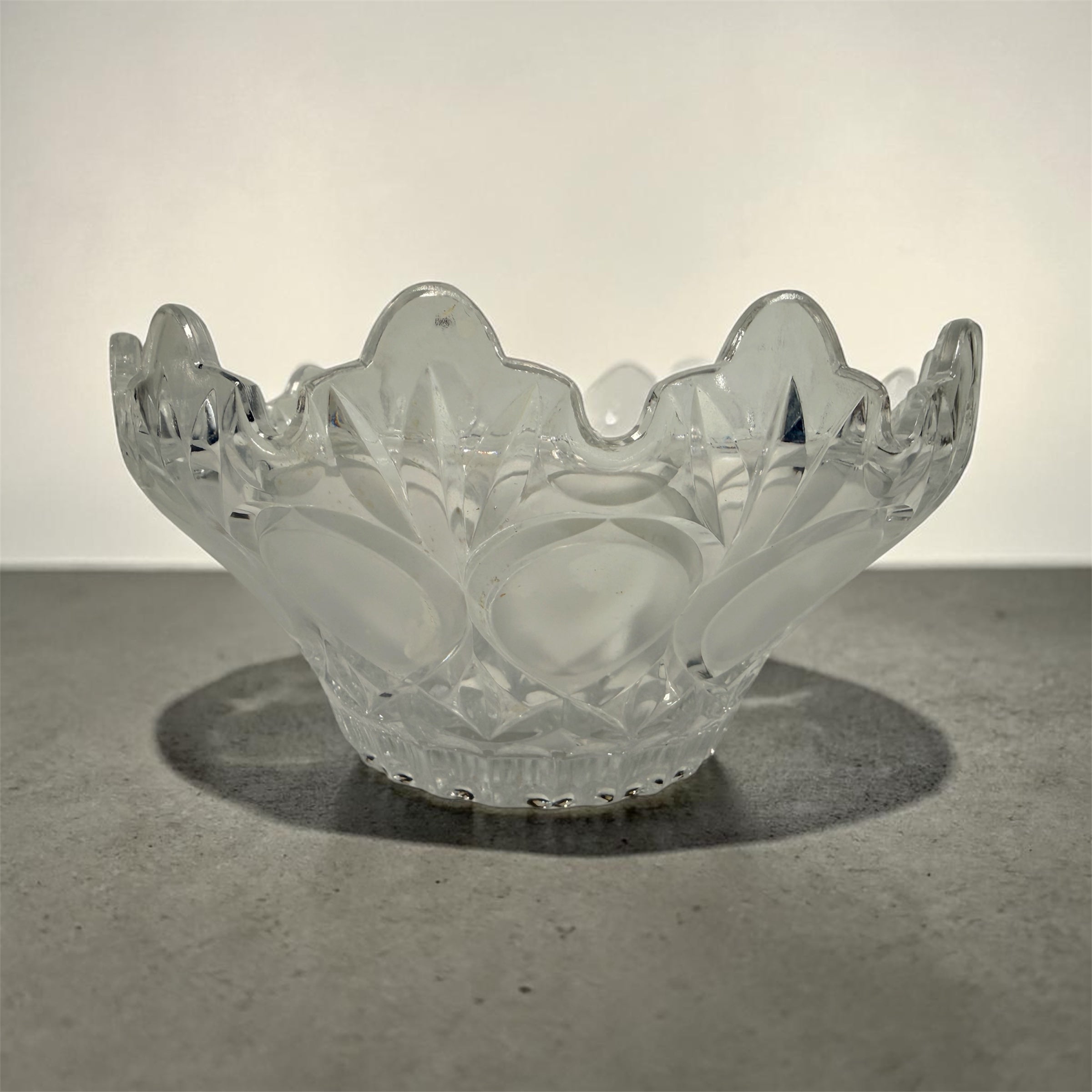 Mid-century pressed glass bowl with frosted thumbprint pattern and scalloped rim. Heavy decorative centerpiece perfect for vintage or retro home decor.