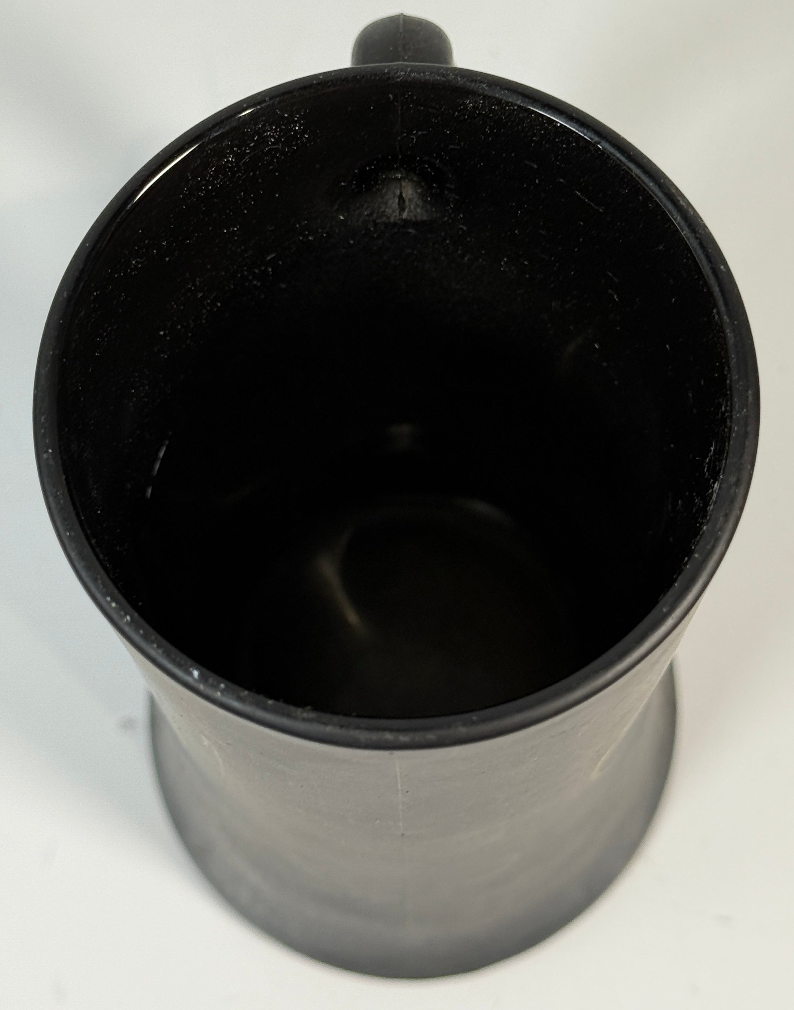 Black mug on a white background