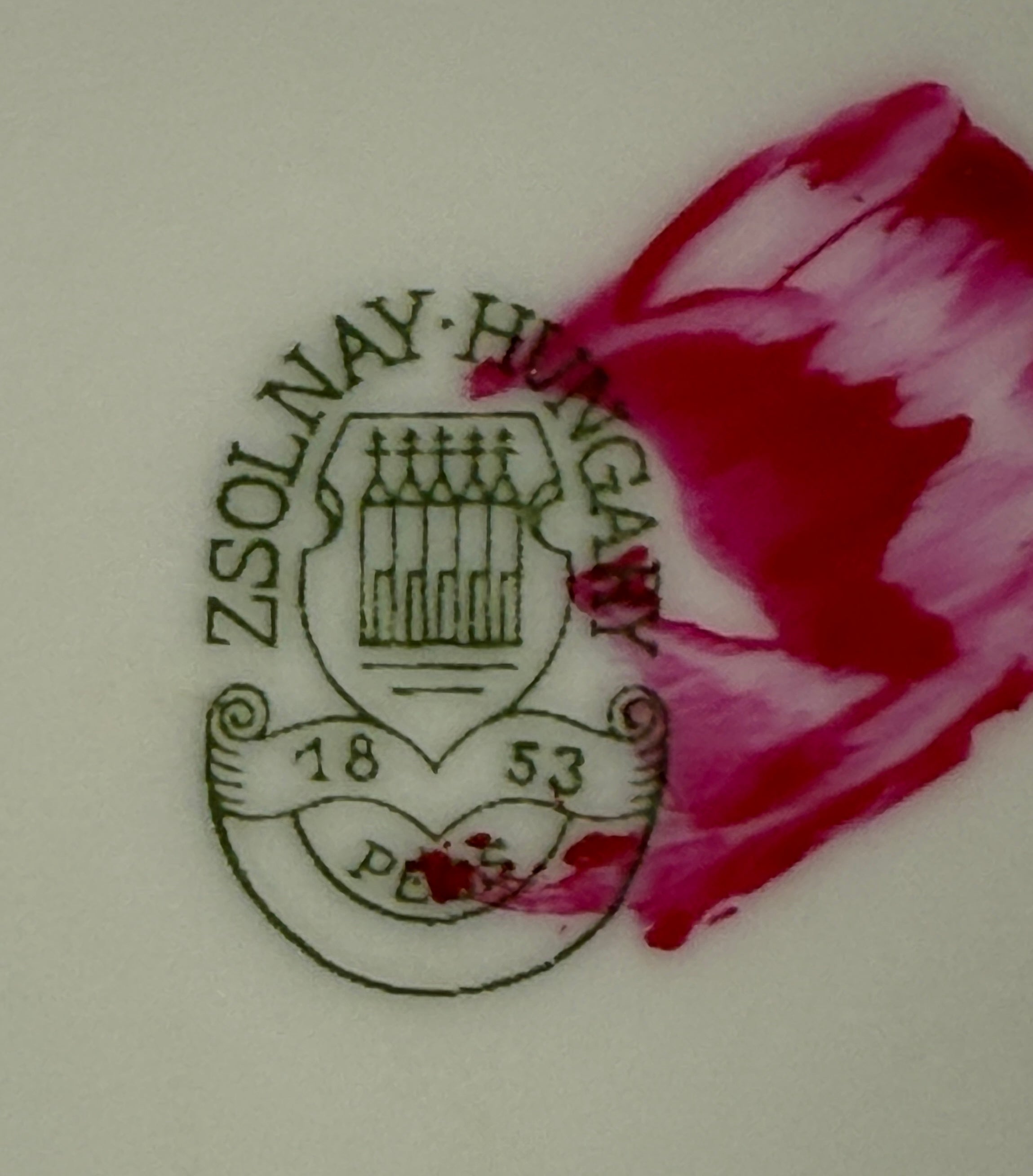 Zsolnay Hungary logo with a pink floral design on a white background
