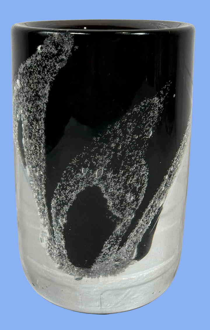 Vase_Kosta_Sweden Black glass tumbler with textured surface on a white background