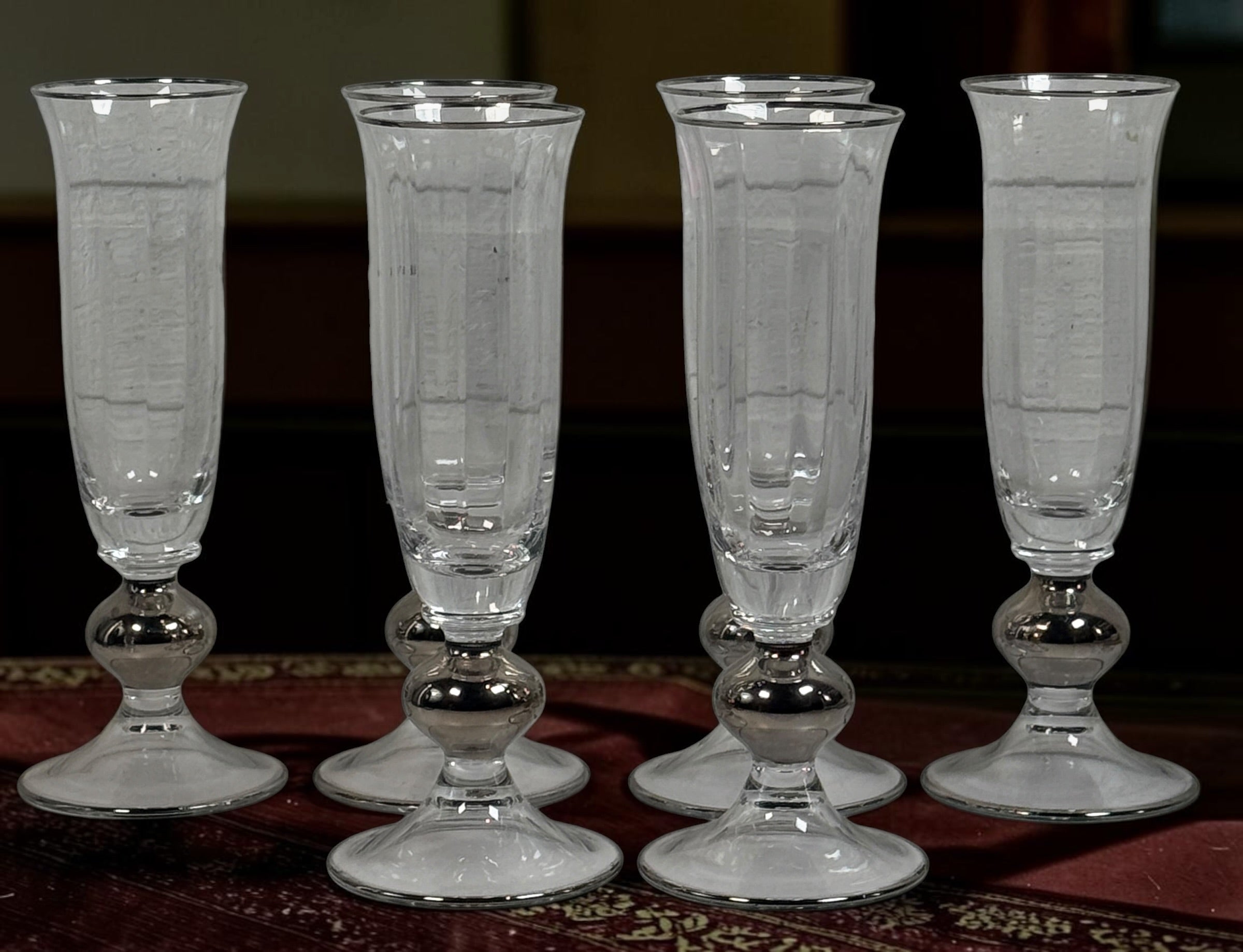 Champagne flutes with silver-tone decoration — product and condition detail