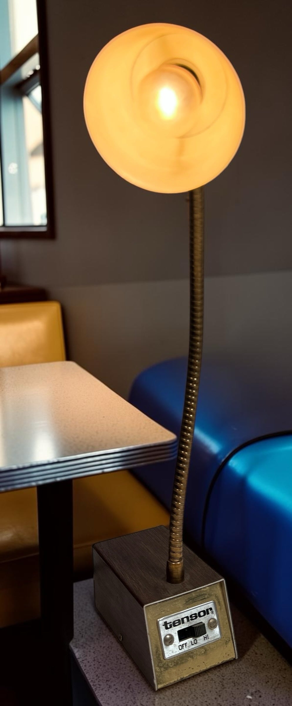 Éco-Dépôt Montréal vintage Tensor desk lamp with flexible gooseneck arm and wood-grain base in a retro setting