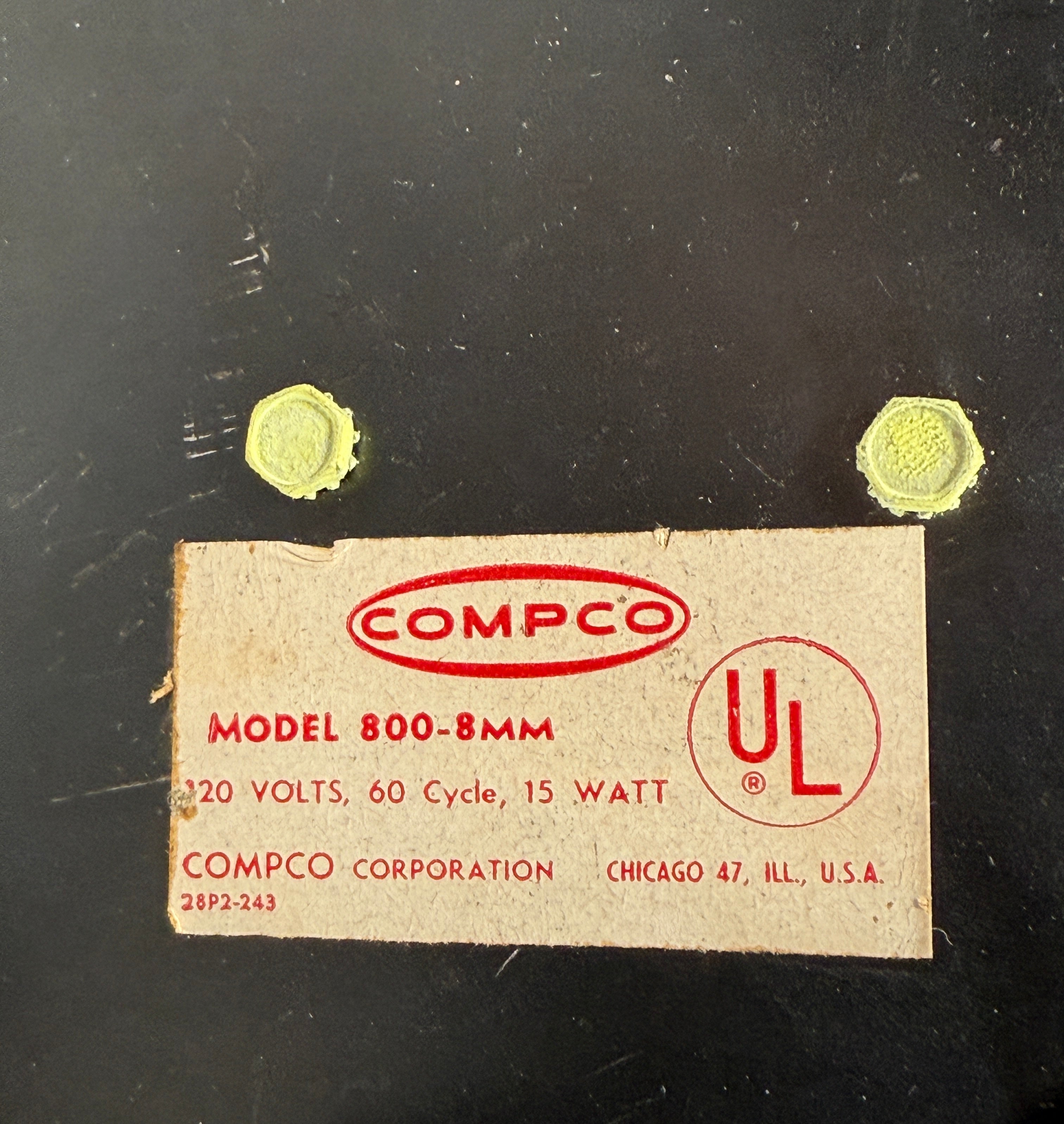 Vintage COMPCO label with model details on a dark background