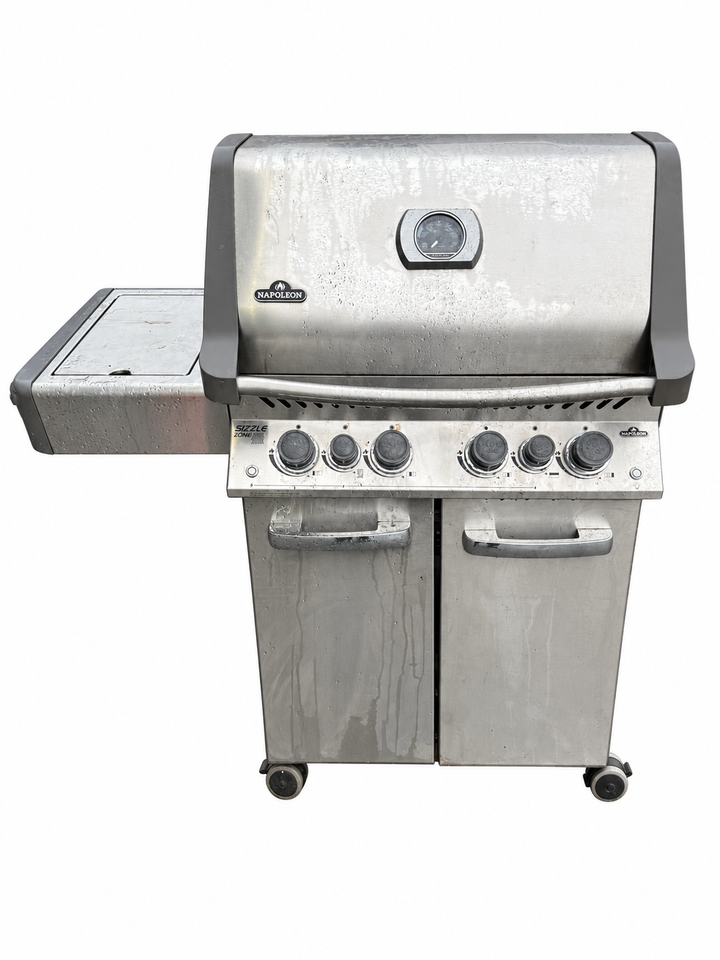 Used Napoleon stainless steel BBQ with right shelf missing, background removed