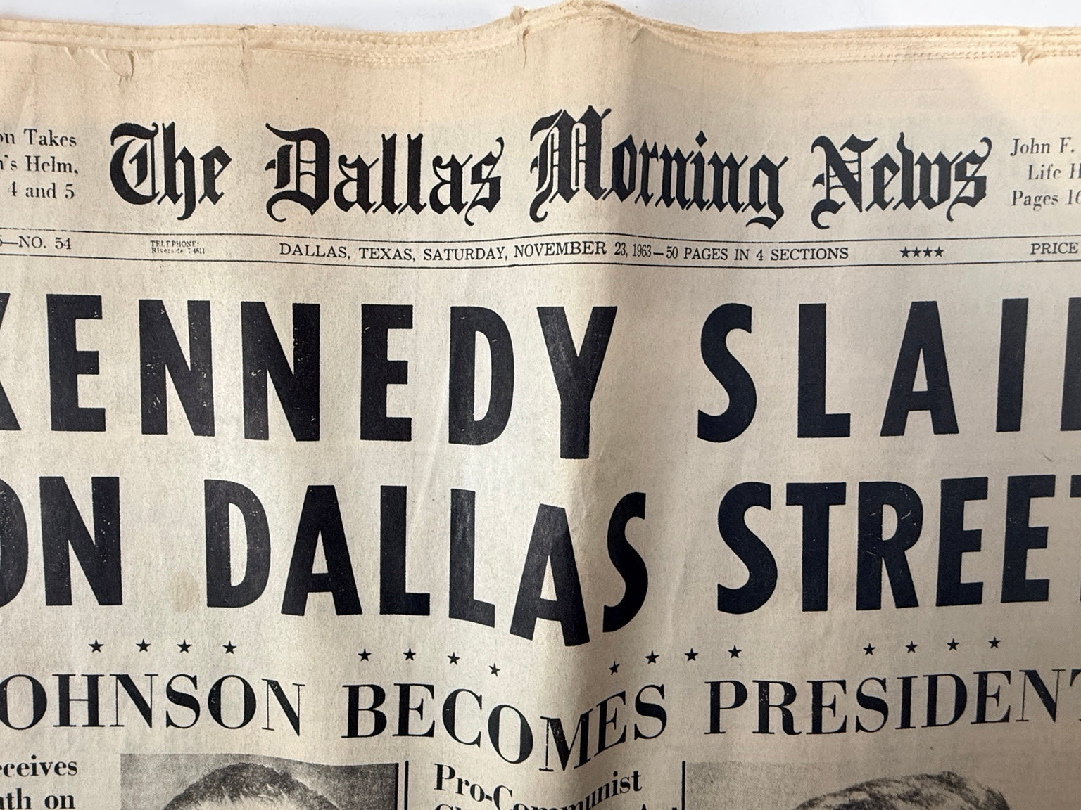 Close-up of Dallas Morning News masthead and Kennedy slain headline