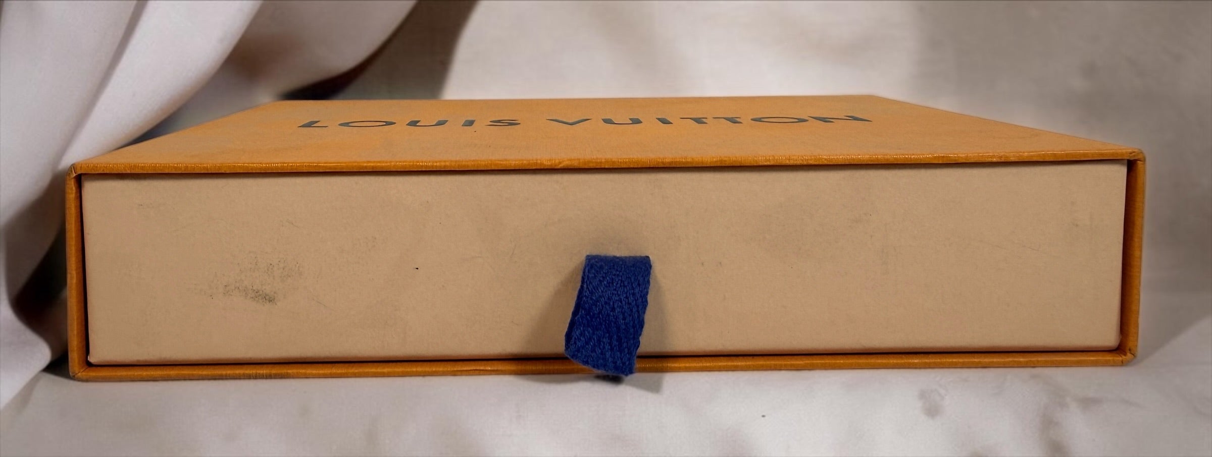 Front of orange Louis Vuitton branded drawer box