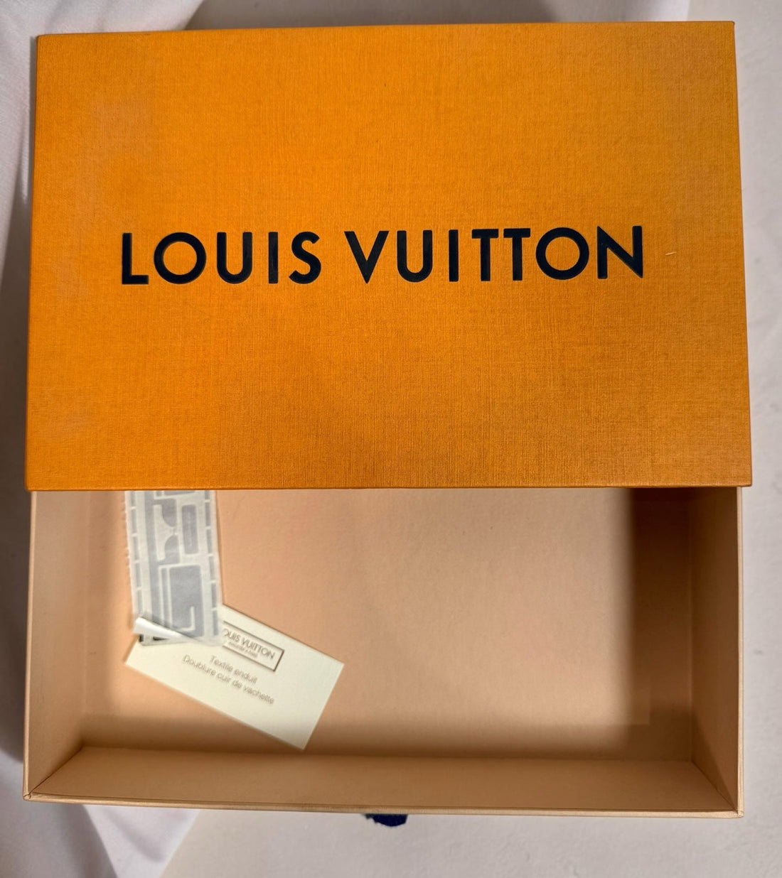 Opened box with paper inserts
