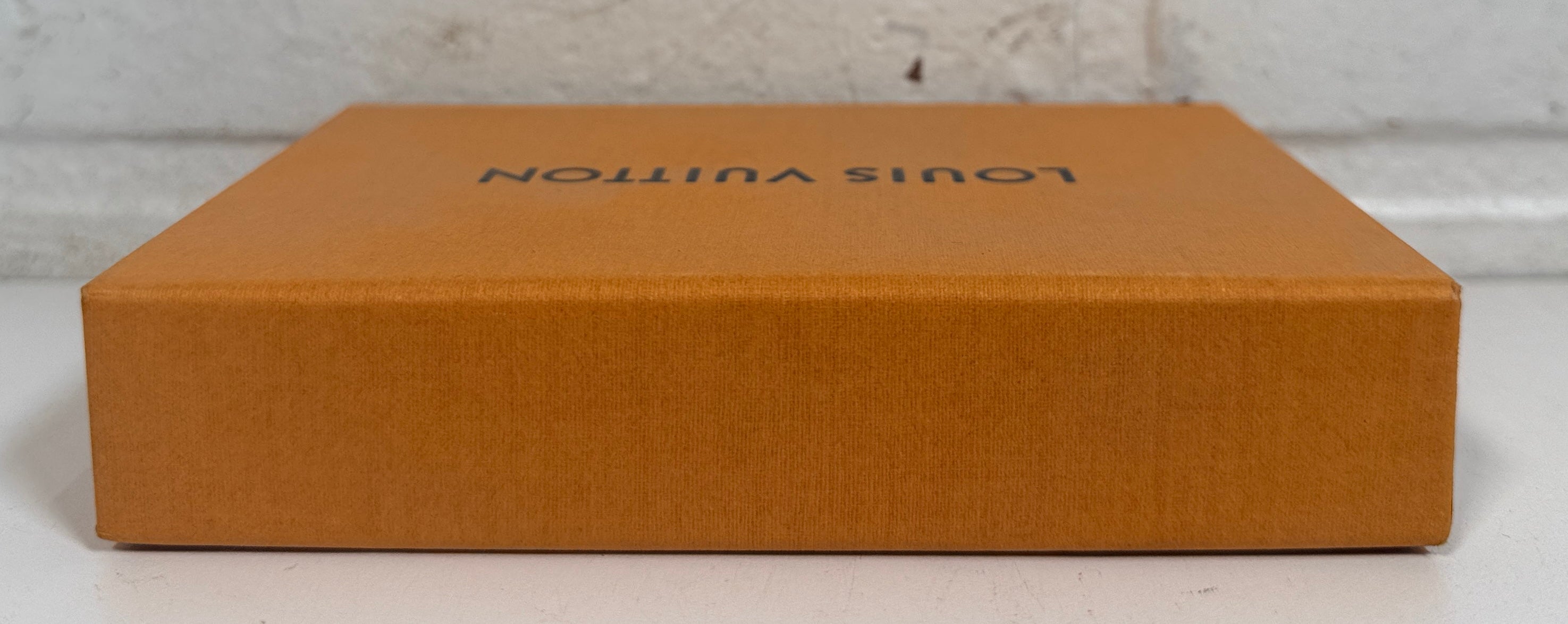 Rear of orange packaging box